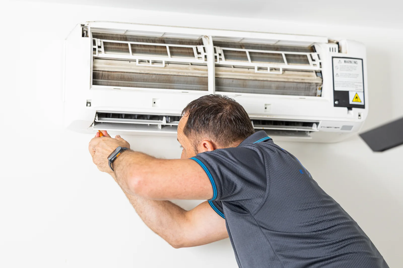 Outdoor air conditioning unit being maintained